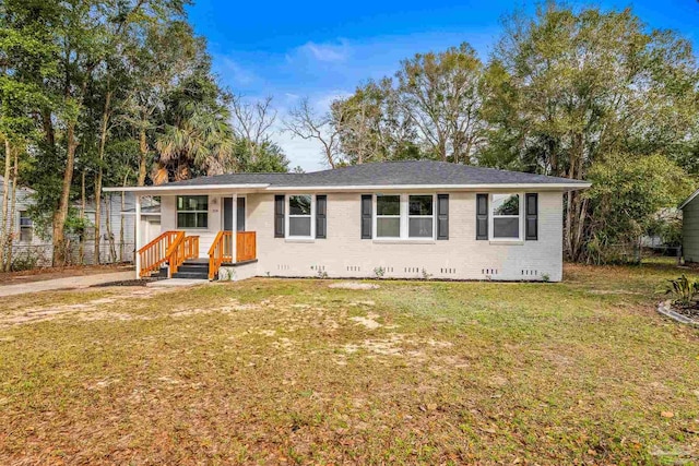 ranch-style home featuring a front yard