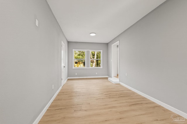 unfurnished room with light hardwood / wood-style flooring