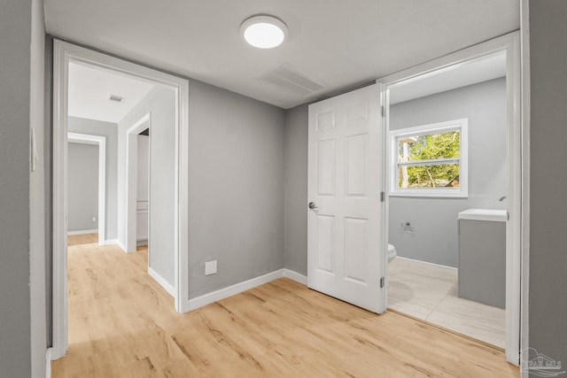 corridor featuring light wood-type flooring