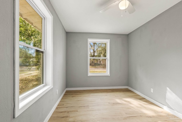 unfurnished room featuring ceiling fan, plenty of natural light, and light hardwood / wood-style floors