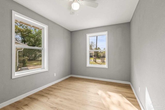 spare room with ceiling fan and light hardwood / wood-style floors