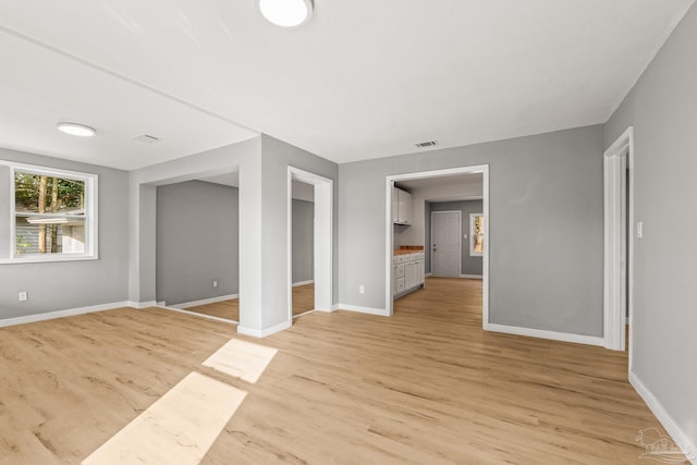 unfurnished bedroom featuring light wood-type flooring