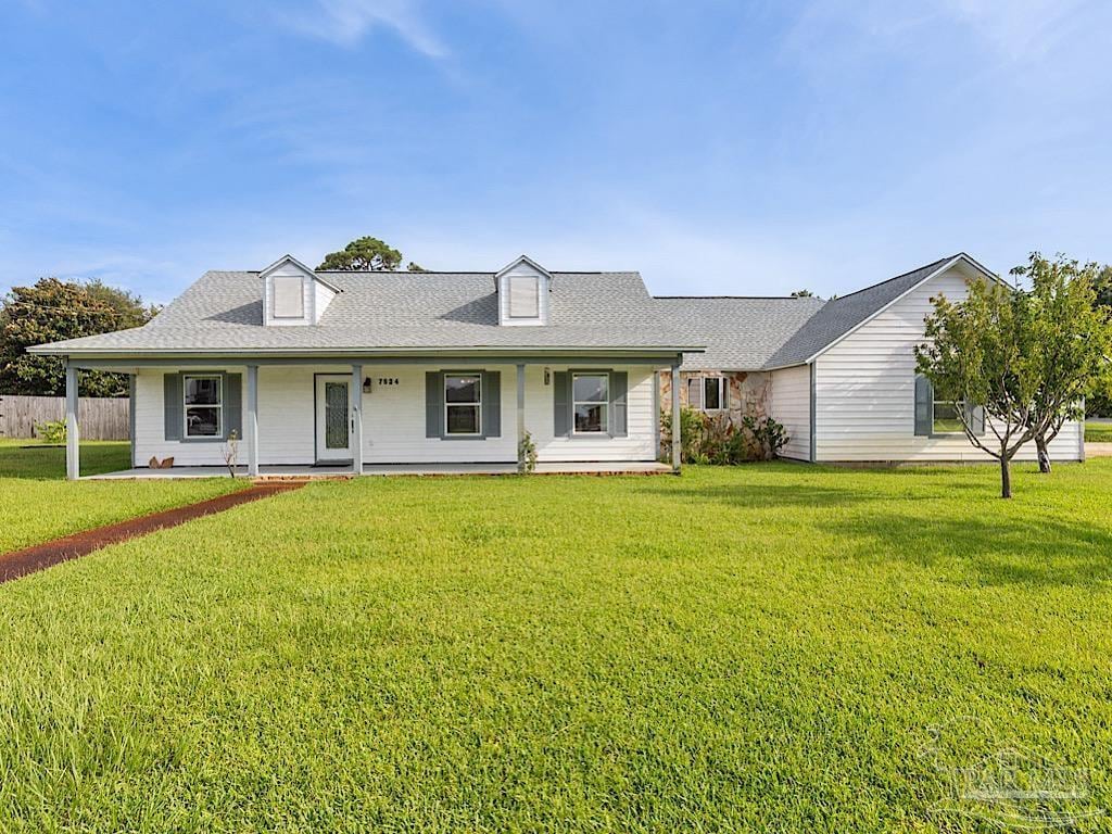 7524 N Shores Dr, Navarre, FL 32566 - view of front of home with a porch and roof with shingles