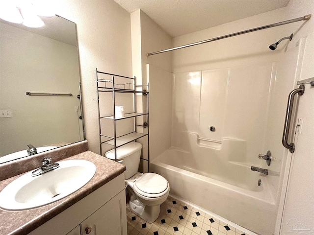 full bathroom with shower / bathing tub combination, vanity, a textured ceiling, and toilet