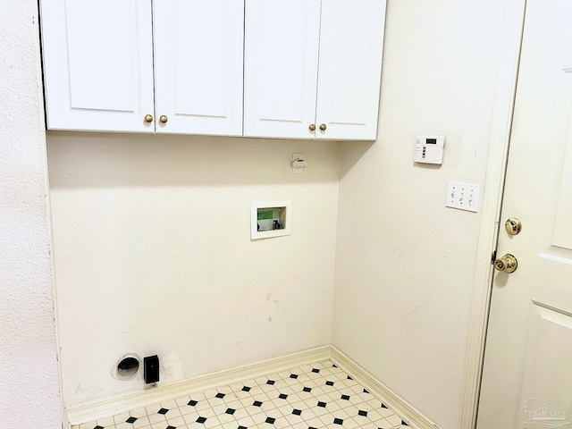 laundry area with electric dryer hookup, cabinets, and hookup for a washing machine