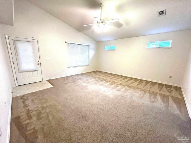 spare room with carpet flooring, ceiling fan, and lofted ceiling