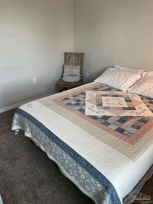 carpeted bedroom with baseboards