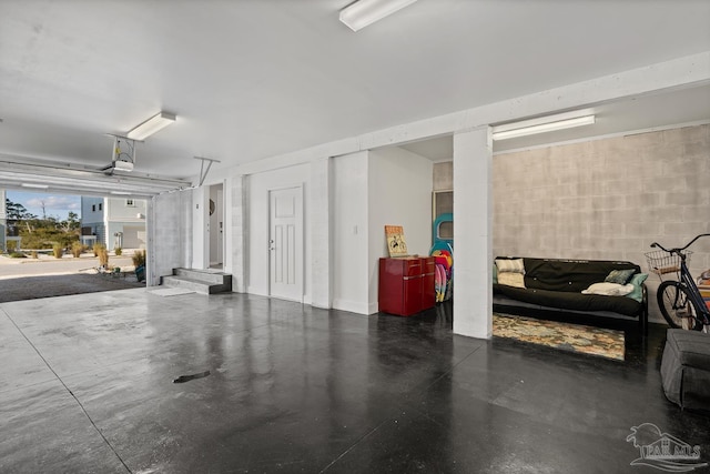 garage with concrete block wall