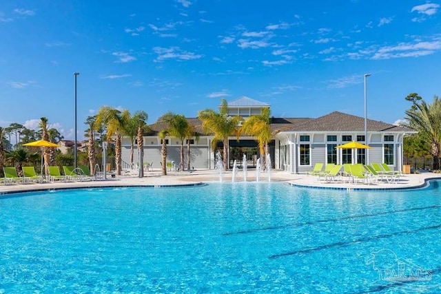 pool featuring a patio and fence