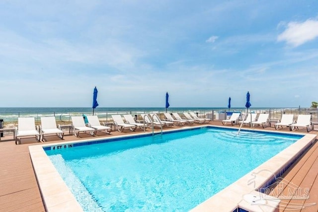 view of pool with a water view