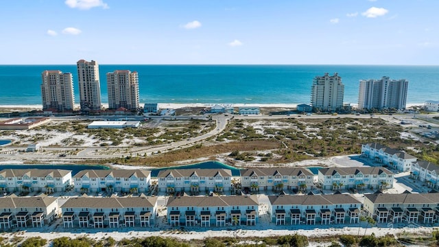 drone / aerial view with a residential view and a water view