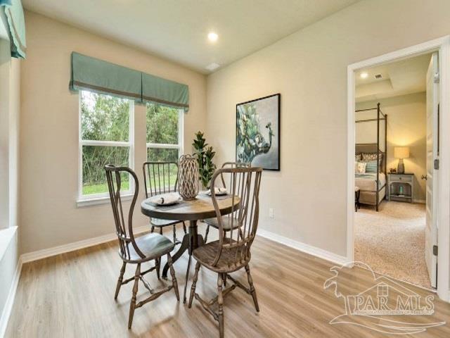 dining area with wood-type flooring