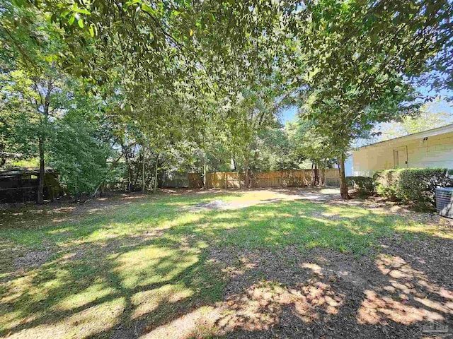 view of yard with a fenced backyard