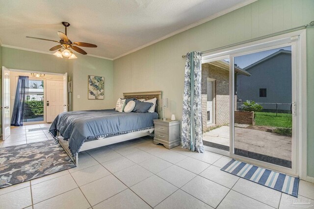 tiled bedroom featuring access to exterior, a textured ceiling, ceiling fan, and ornamental molding