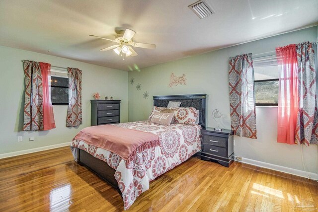 bedroom featuring light hardwood / wood-style flooring and ceiling fan