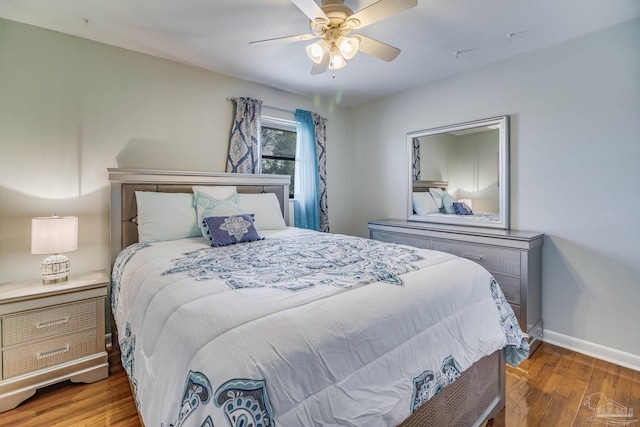 bedroom featuring ceiling fan and dark hardwood / wood-style floors