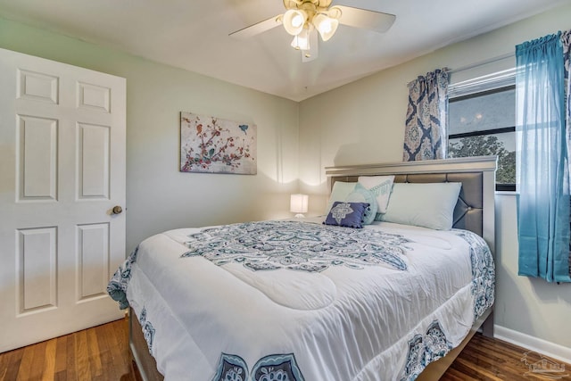 bedroom featuring ceiling fan and dark wood-type flooring