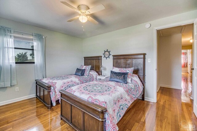 bedroom featuring ceiling fan and light wood-type flooring