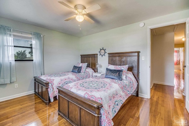 bedroom featuring ceiling fan and light hardwood / wood-style flooring