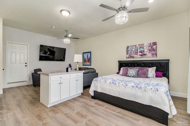 bedroom featuring ceiling fan and light wood-type flooring