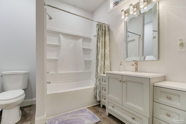 full bathroom featuring vanity, wood-type flooring, shower / tub combo, and toilet