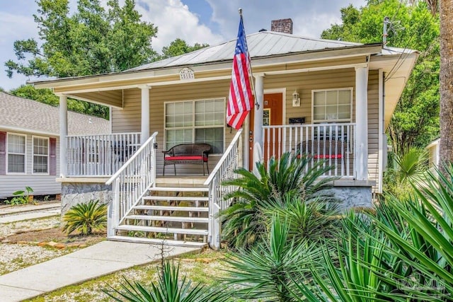 518 W Strong St Unit A & B, Pensacola, FL 32501 - bungalow with a porch, metal roof, and a chimney