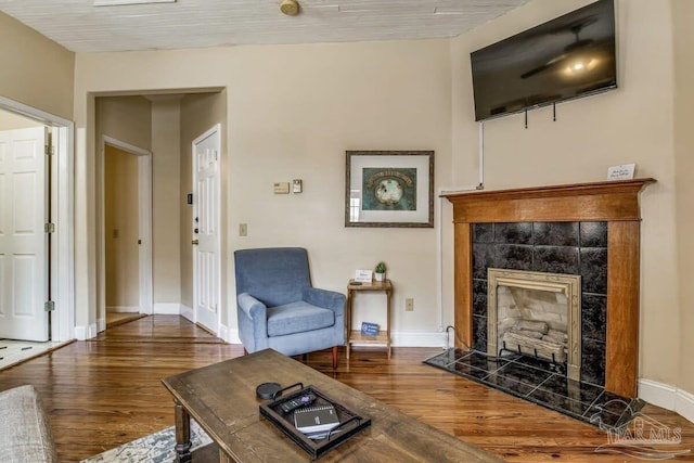 518 W Strong St Unit A & B, Pensacola, FL 32501 - living room featuring wood finished floors, a fireplace, and baseboards