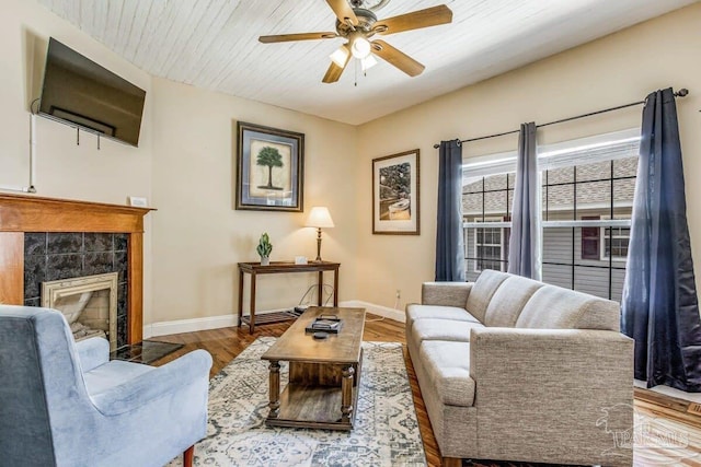 518 W Strong St Unit A & B, Pensacola, FL 32501 - living room with wood finished floors, a fireplace, a ceiling fan, and baseboards