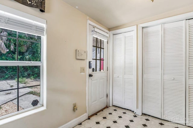 518 W Strong St Unit A & B, Pensacola, FL 32501 - entryway with baseboards, light floors, and a healthy amount of sunlight
