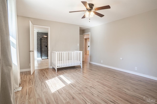 unfurnished bedroom featuring ceiling fan and light hardwood / wood-style flooring