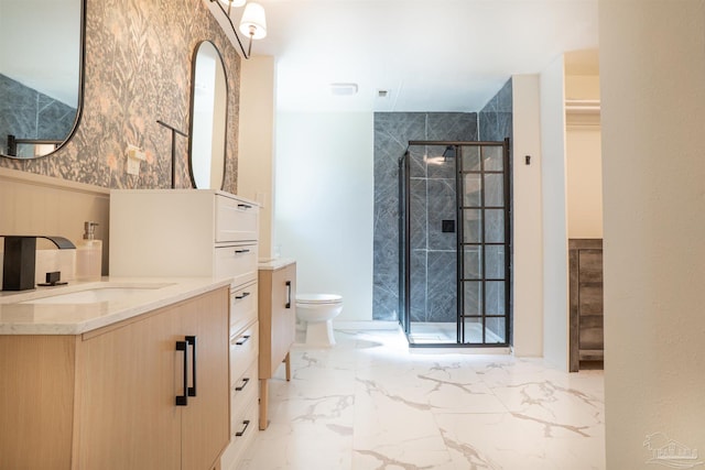 bathroom with vanity, an enclosed shower, and toilet