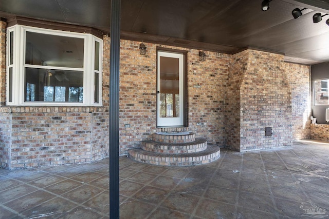 entrance to property featuring a patio