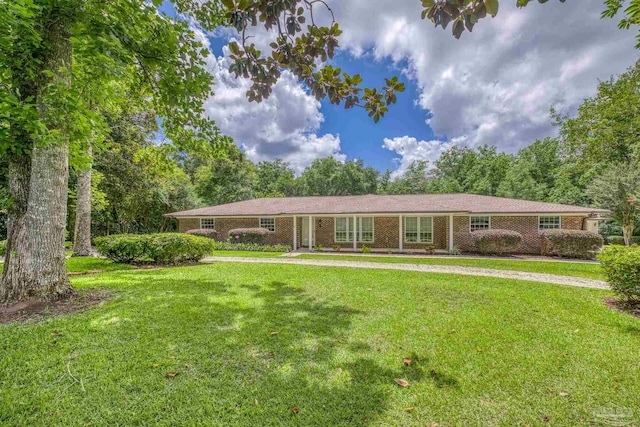 1213 Tecumseh Pl, Pensacola, FL 32514 - single story home featuring a front yard and brick siding