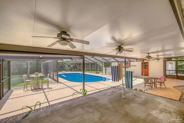 1213 Tecumseh Pl, Pensacola, FL 32514 - swimming pool with a patio, a ceiling fan, glass enclosure, and outdoor dining area