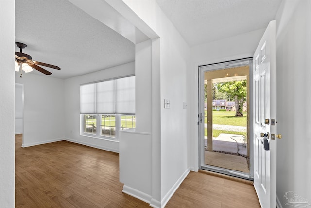 1213 Tecumseh Pl, Pensacola, FL 32514 - foyer entrance featuring wood finished floors, a textured ceiling, and ceiling fan