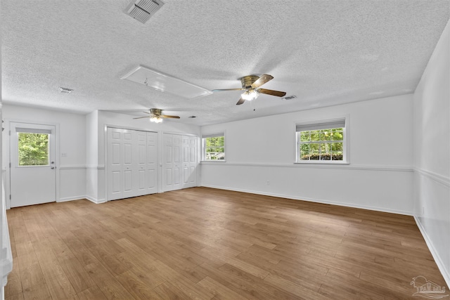 1213 Tecumseh Pl, Pensacola, FL 32514 - unfurnished room featuring attic access, ceiling fan, wood finished floors, and a textured ceiling