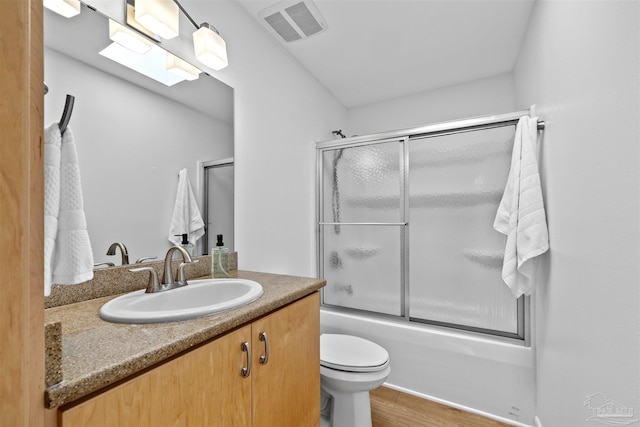 1213 Tecumseh Pl, Pensacola, FL 32514 - bathroom with vanity, bath / shower combo with glass door, and wood finished floors