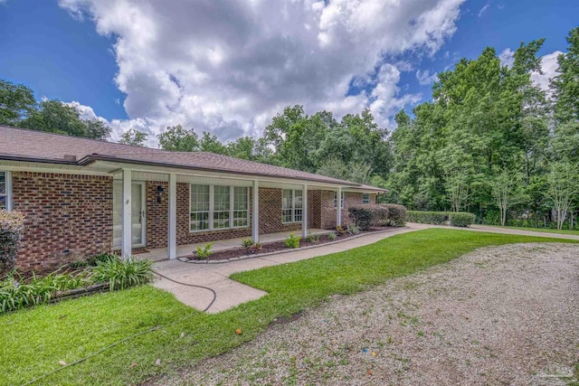 1213 Tecumseh Pl, Pensacola, FL 32514 - single story home with brick siding and a front yard