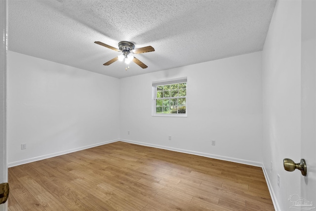 1213 Tecumseh Pl, Pensacola, FL 32514 - empty room with ceiling fan, wood finished floors, and a textured ceiling