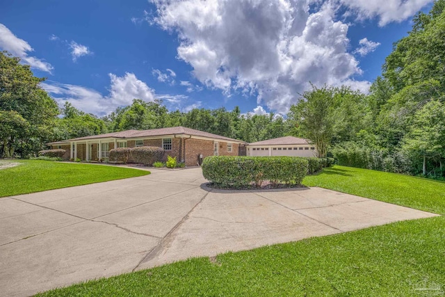 1213 Tecumseh Pl, Pensacola, FL 32514 - view of front of house with a front lawn and brick siding