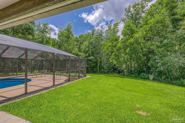 1213 Tecumseh Pl, Pensacola, FL 32514 - view of green lawn featuring a patio area, an outdoor pool, and a lanai