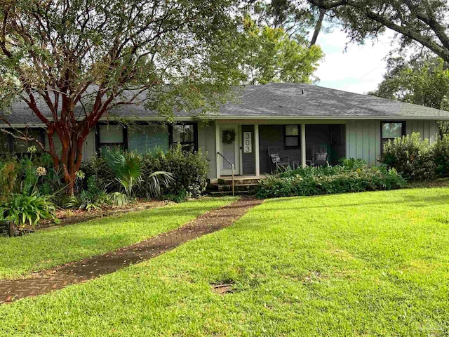 ranch-style home featuring a front yard