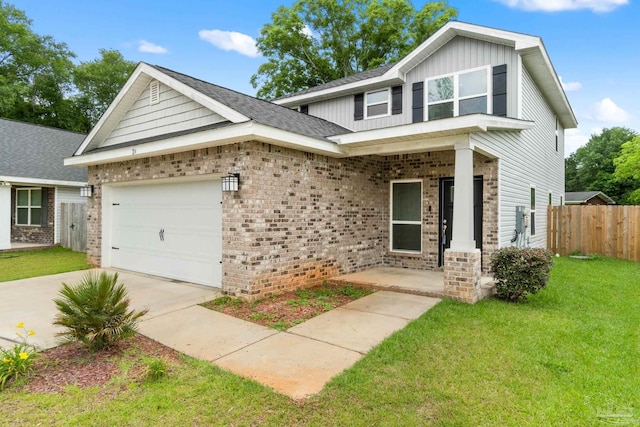 124 Polo Ter, Pensacola, FL 32534 - view of front of home featuring brick siding, concrete driveway, board and batten siding, and a garage