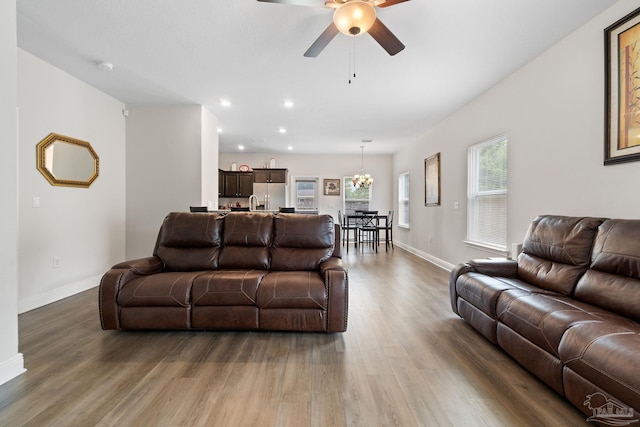 124 Polo Ter, Pensacola, FL 32534 - living area with wood finished floors, a ceiling fan, baseboards, a chandelier, and recessed lighting