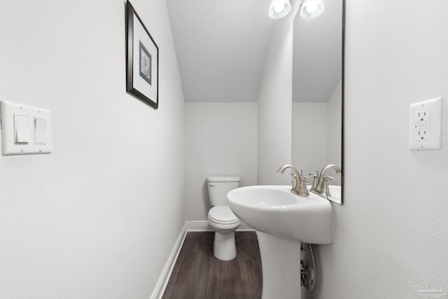 124 Polo Ter, Pensacola, FL 32534 - half bathroom featuring wood finished floors, toilet, and baseboards