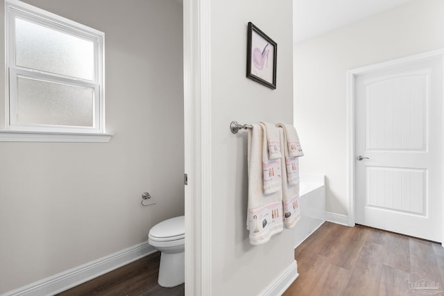 124 Polo Ter, Pensacola, FL 32534 - bathroom with wood finished floors, baseboards, toilet, and a bathtub