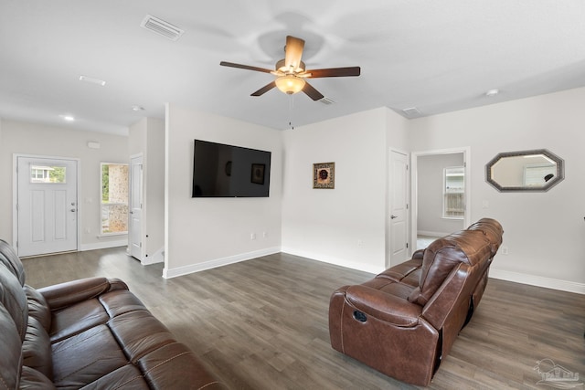124 Polo Ter, Pensacola, FL 32534 - living room featuring a ceiling fan, dark wood-style flooring, and baseboards