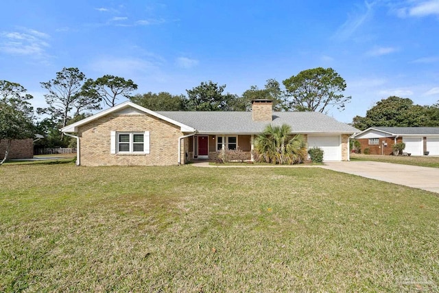 ranch-style home featuring driveway, an attached garage, a chimney, a front lawn, and brick siding