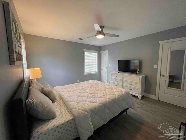 bedroom with hardwood / wood-style flooring and ceiling fan