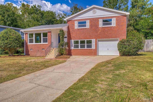 tri-level home with a front yard and a garage